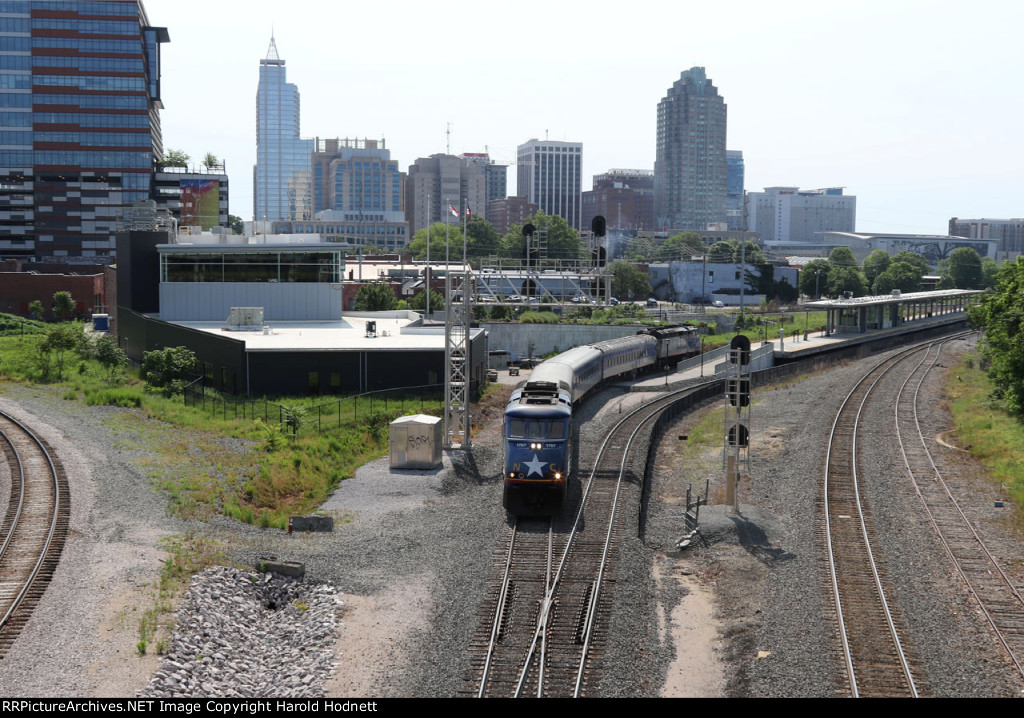 RNCX 1797 leads train 75 away from the station